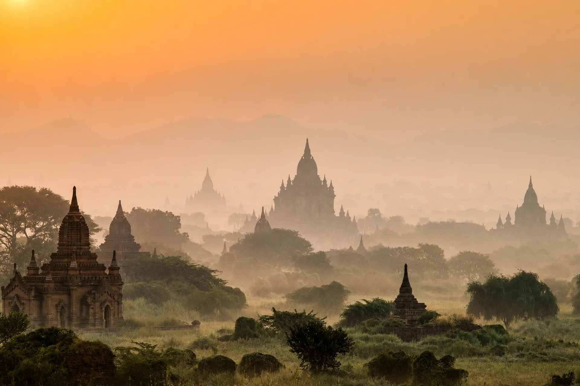 The temples of Bagan at dawn, Myanmar — golden mist over a thousand-year-old plain